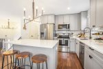 Stone counters and stainless appliances grace this updated space 